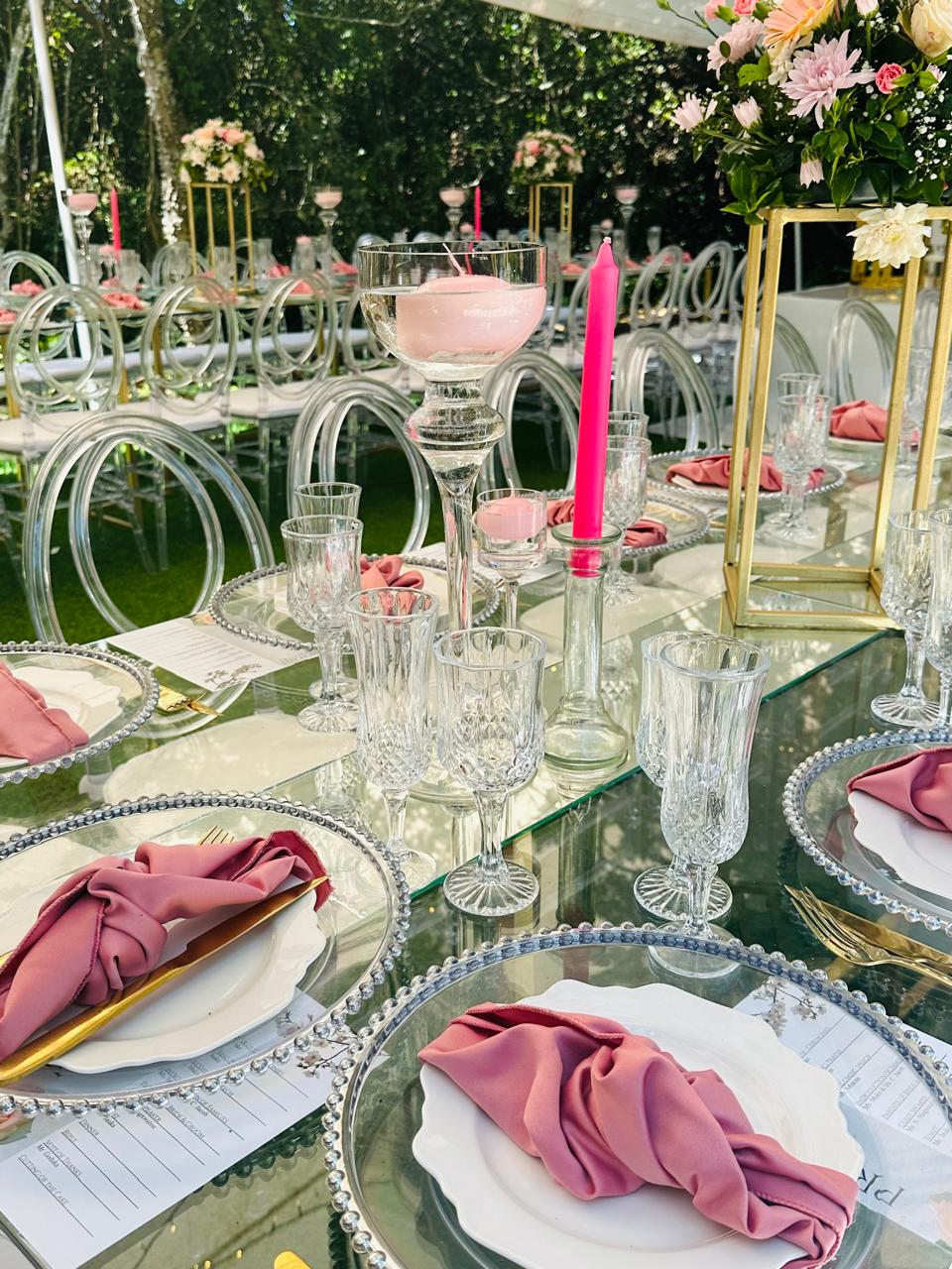 Mirror table setting with crystal glassware and blush napkins